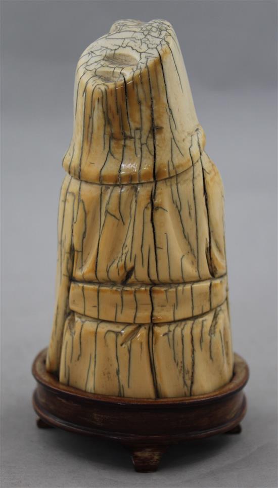 A Chinese mammoth ivory tusk carving of a seated figure of Li Bai, 20th century, 14cm, wood stand